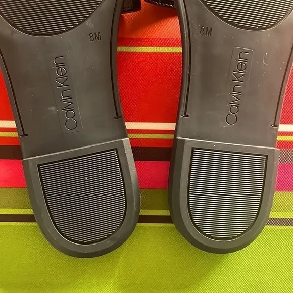 Brand New Calvin Klein Black Large Strap Sandals Flats w/ Gold Tone Metal Logo