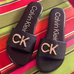 Brand New Calvin Klein Black Large Strap Sandals Flats w/ Gold Tone Metal Logo