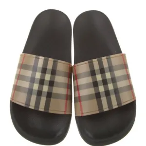 Burberry plaid print rubber slides.