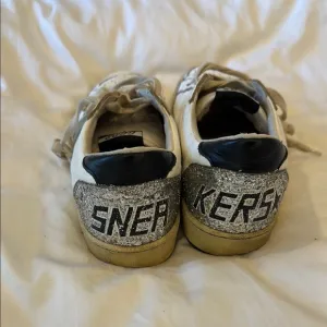 Golden Goose White and Black Low-Top Sneakers
