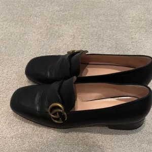 Gucci Black and Gold Loafers with Signature GG Hardware