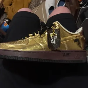Nike Gold and Black Sneakers with Metallic Finish