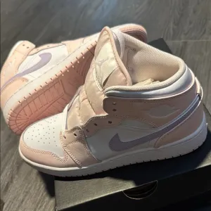 Nike Pink and White Sneakers with Classic Design